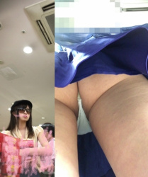 【逆さ撮り】大事なところがはみ出しそうになってるTバックの逆さ撮りパンチラ画像の画像